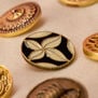 Surreal motifs coat button set